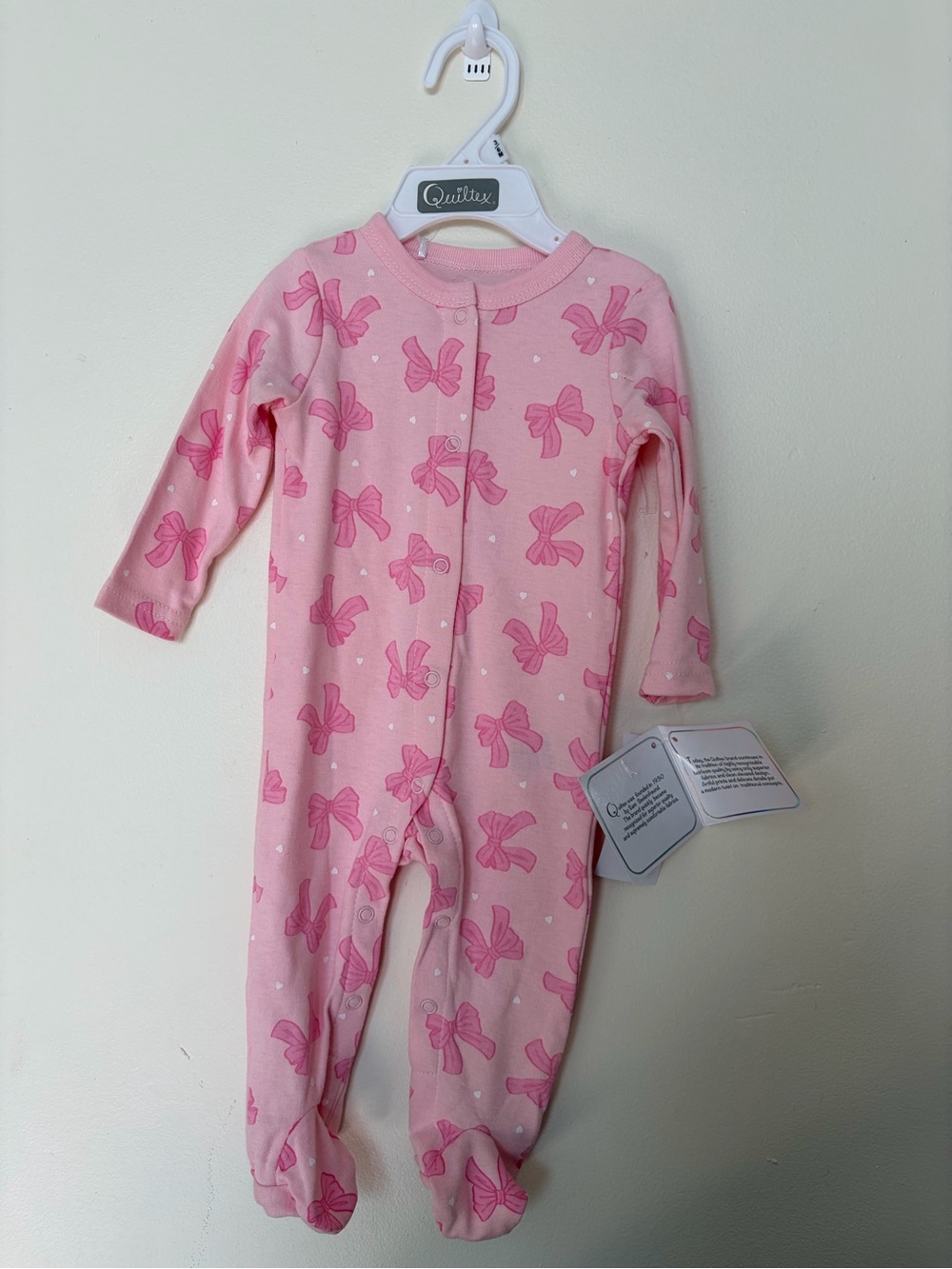 Quiltex Light Pink Footed One-Piece with Bow Print